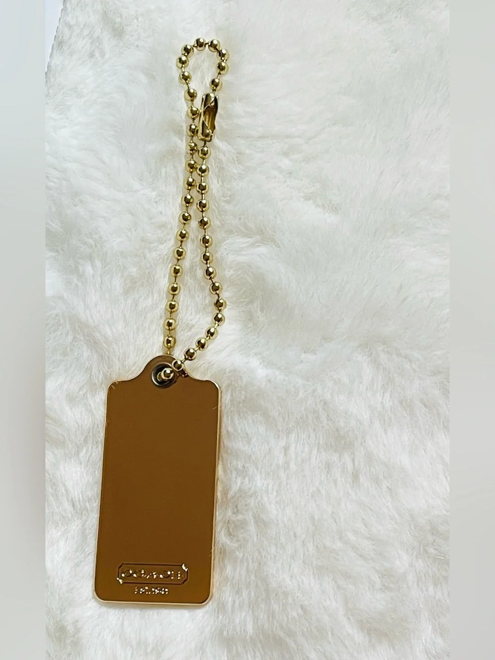 Coach Authentic hangtag gold